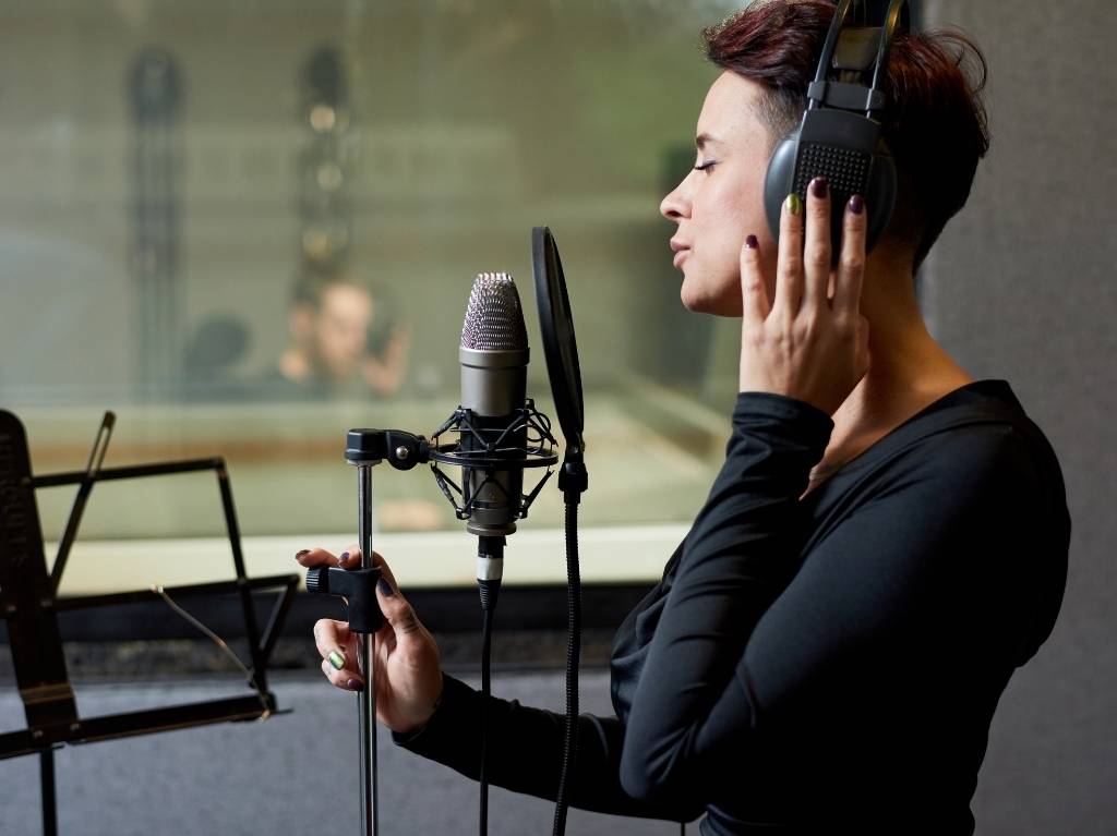 Why do singers wear headphones