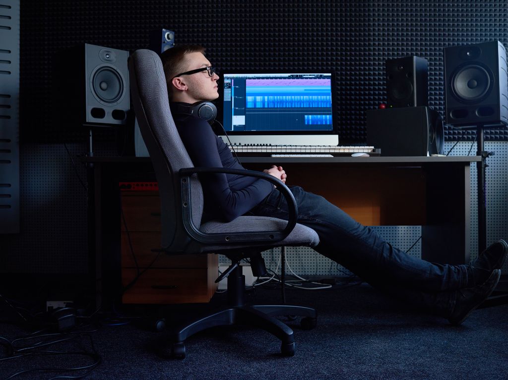 Best Recording Studios in Watkinsville - sound engineer chilling at studio desk